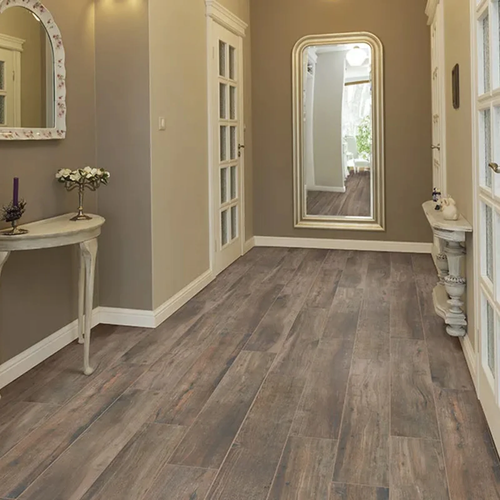 Wood look tile flooring installed in elegant hallway